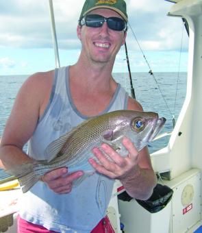 Jason Higgs with a typical pearl perch caught on the day. 